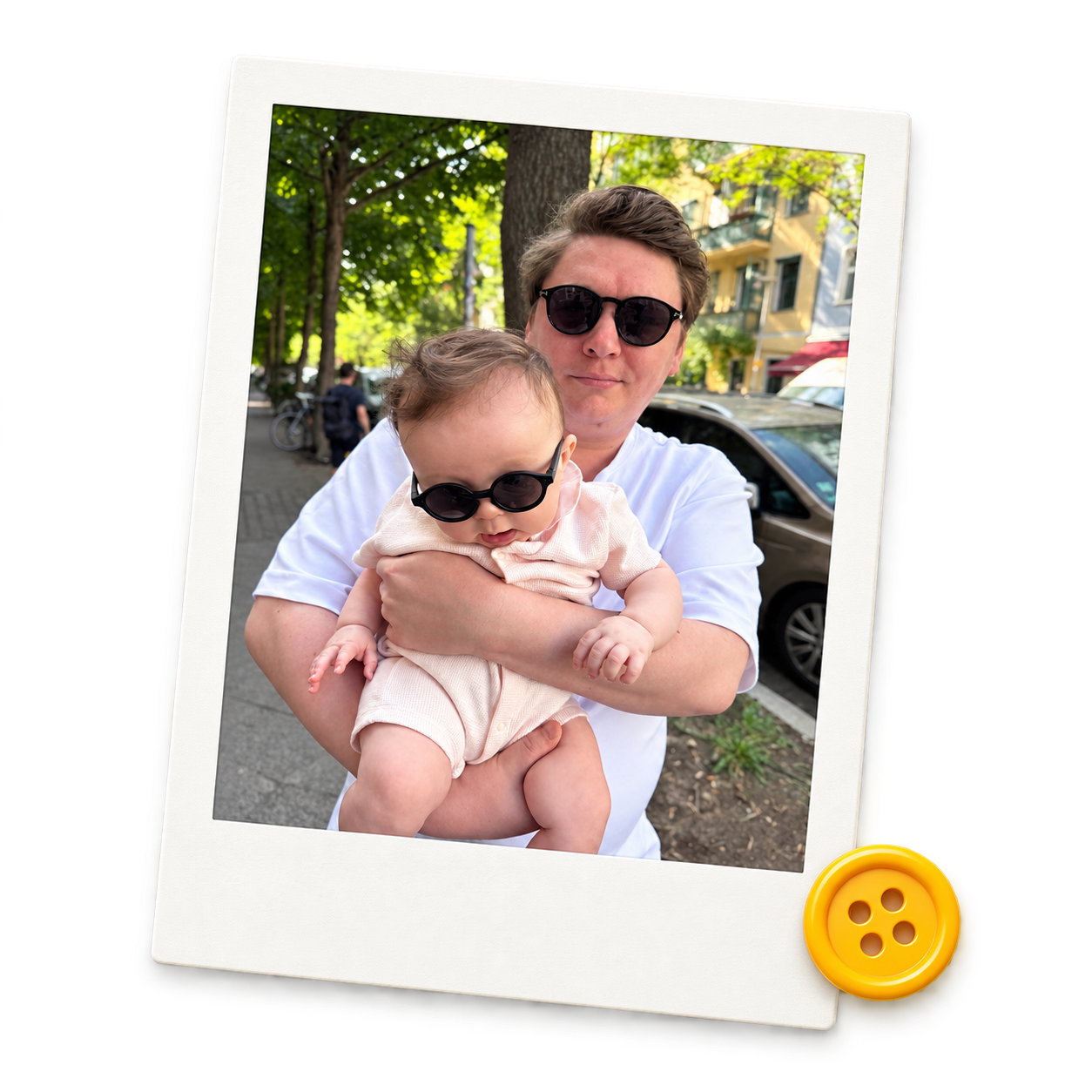 Ilya holding Michelle in Berlin, framed as a Polaroid beside a yellow button